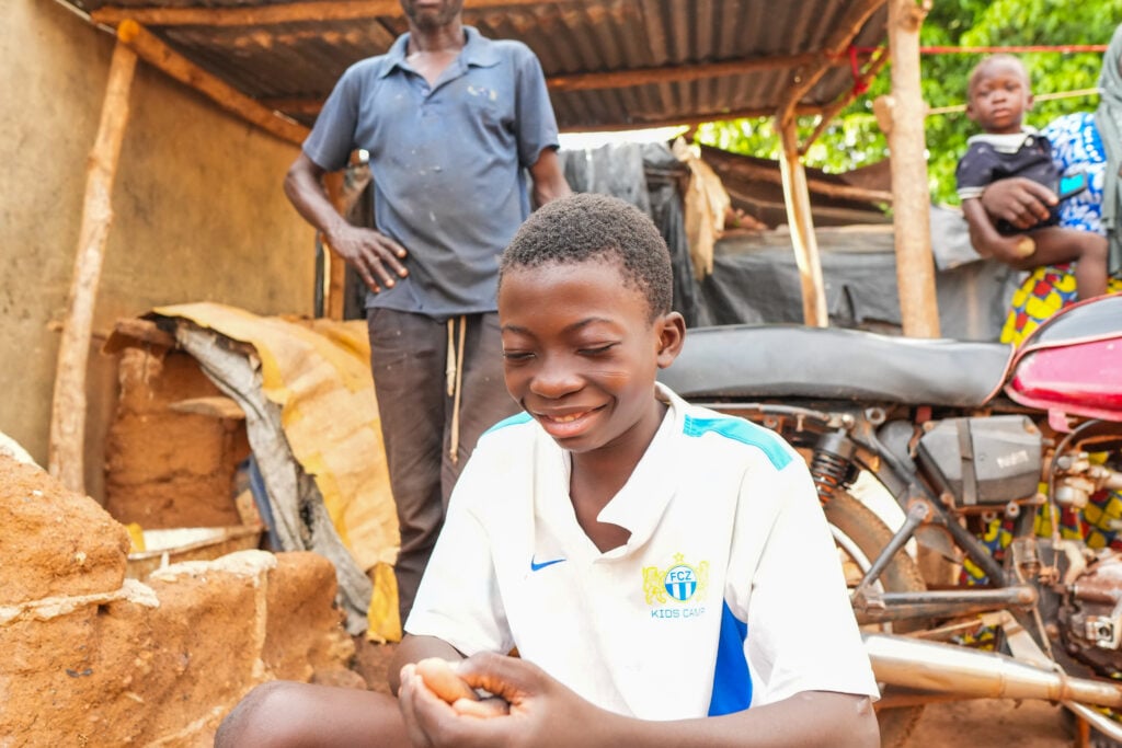 Boukari smiling after regaining clear sight through cataract surgery