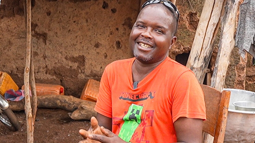 Kabafei Tchilabalo with his child after receiving cataract care in Togo.