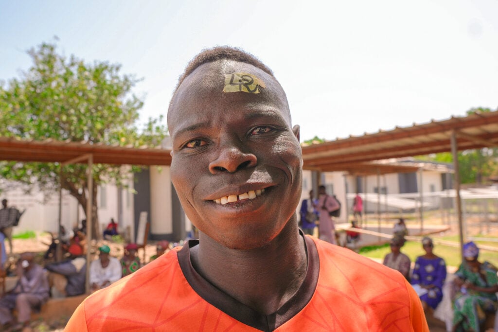 Fefelga smiling after cataract surgery during Sight.org outreach in rural Togo