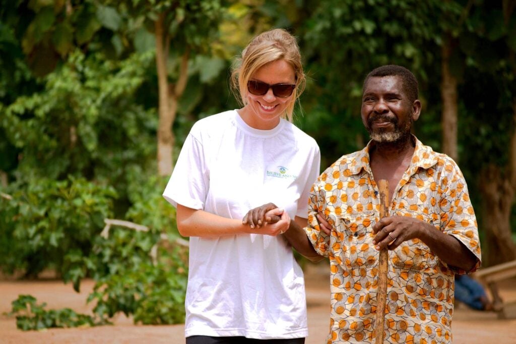 Patient being guided during a Sight.org outreach in West Africa
