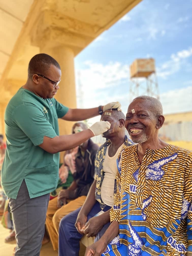 Sight.org team member providing eye care during cataract outreach in rural Togo