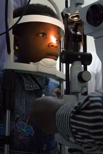 African boy getting eye exam before cataract surgery African boy getting eye exam before cataract surgery