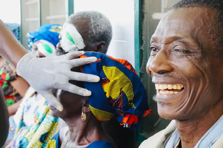 African man smiling after receiving cataract surgery African man smiling after receiving cataract surgery