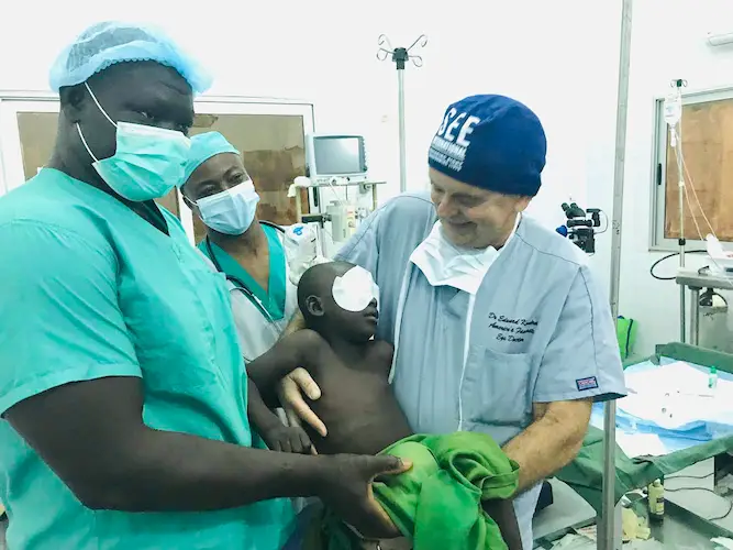 Dr. Kondrot smiles after completing cataract surgery on an African boy Dr. Kondrot smiles after completing cataract surgery on an African boy
