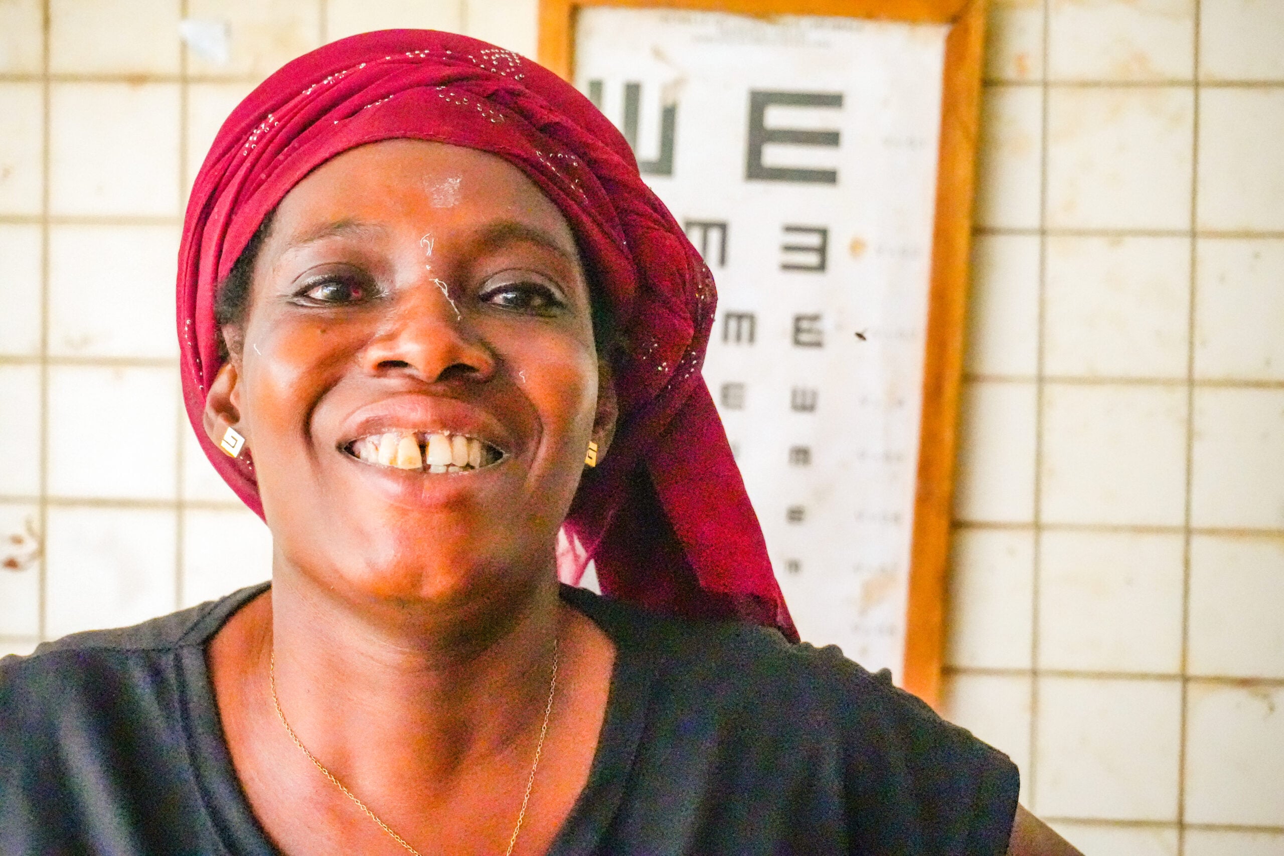 Odah Afi smiling after cataract surgery through Sight.org outreach in Togo