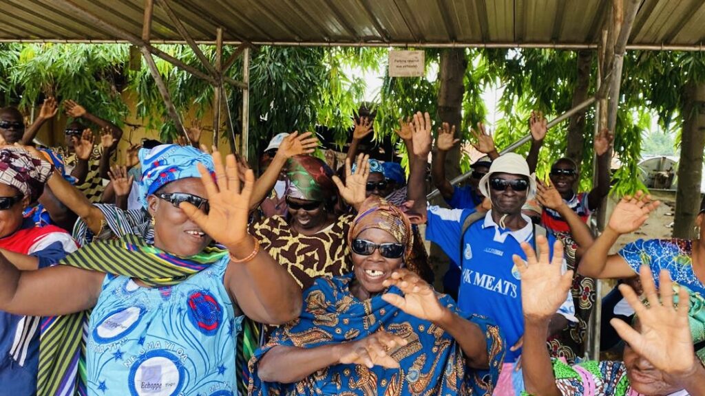 Patients and community members celebrating restored sight during Sight.org outreach in Togo