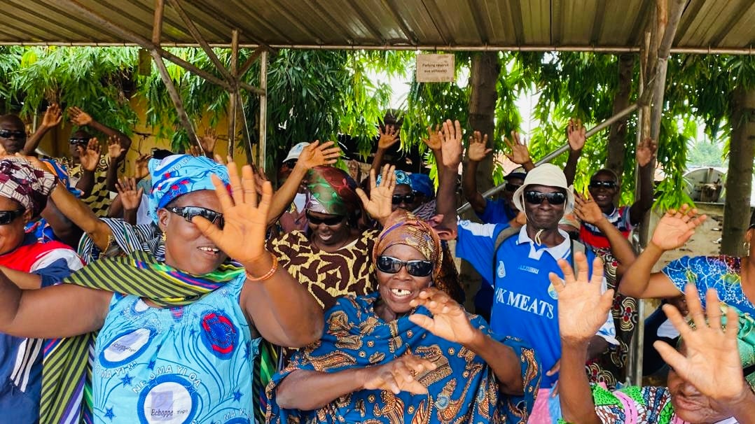 Patients and community members celebrating restored sight during Sight.org outreach in Togo